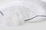 Adjustable pillow with plush hypoallergenic fill gently spilling from open zipper