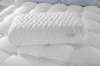 Aireloom Nimbus Visco pillow resting on a plush white mattress