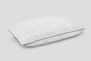 Luxury pillow with textured, breathable cover and seamless piping, fully fluffed